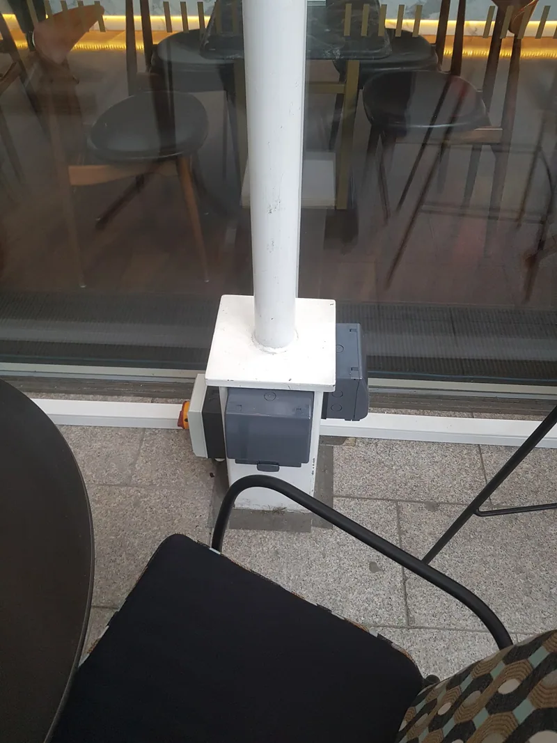 Outdoor power point on a post on a terrace